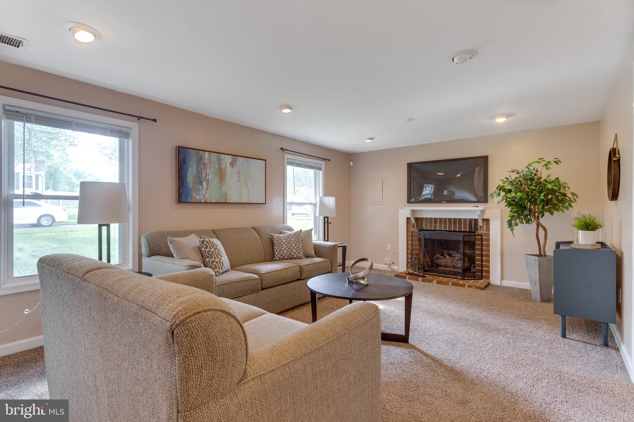 9010 Ridge Drive Fort Washington, MD 20744 - Photo 15 of 35 Lower level rec room with gas log fireplace