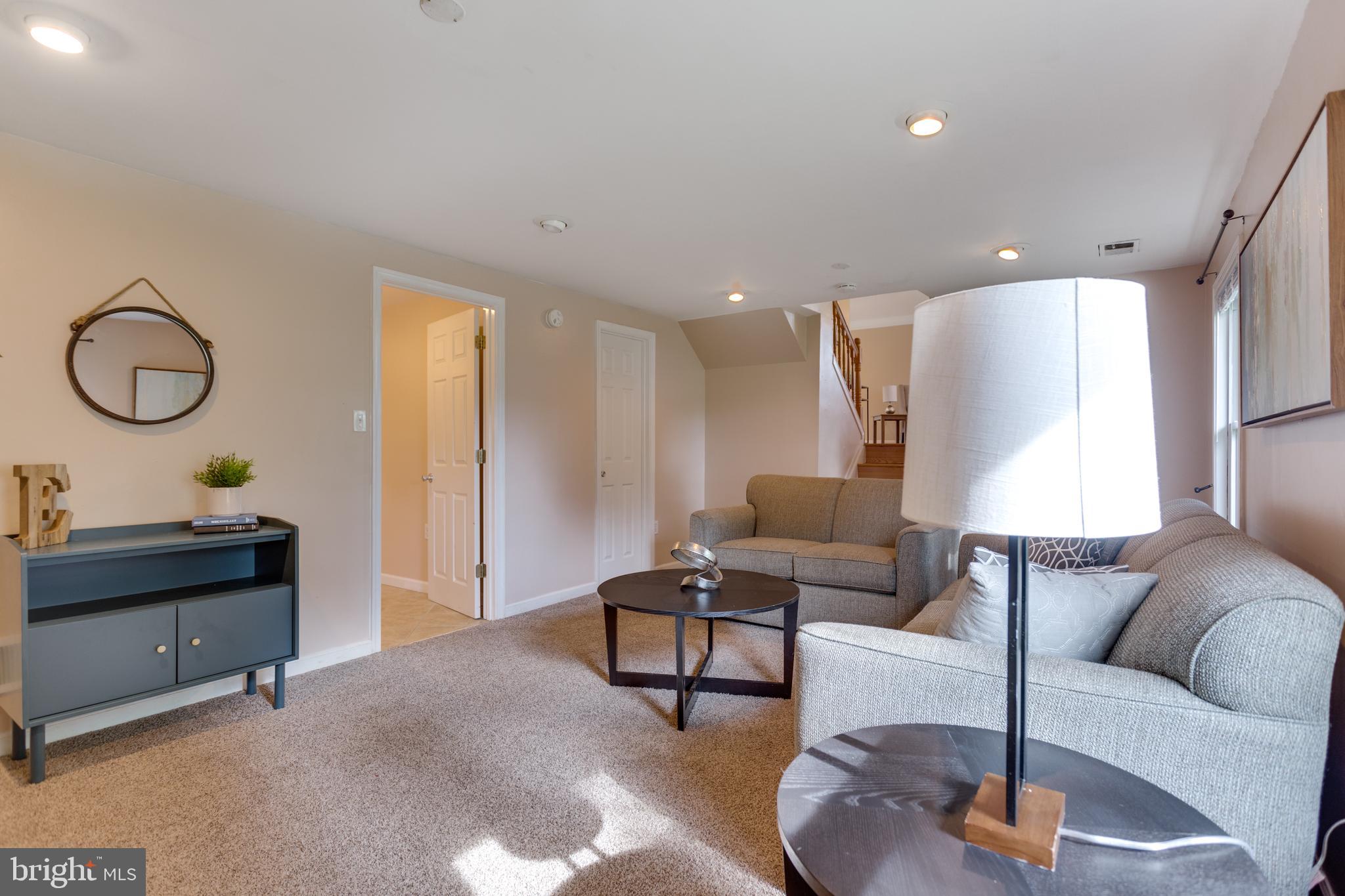 9010 Ridge Drive Fort Washington, MD 20744 - Photo 16 of 35 Lower level rec room with carpet