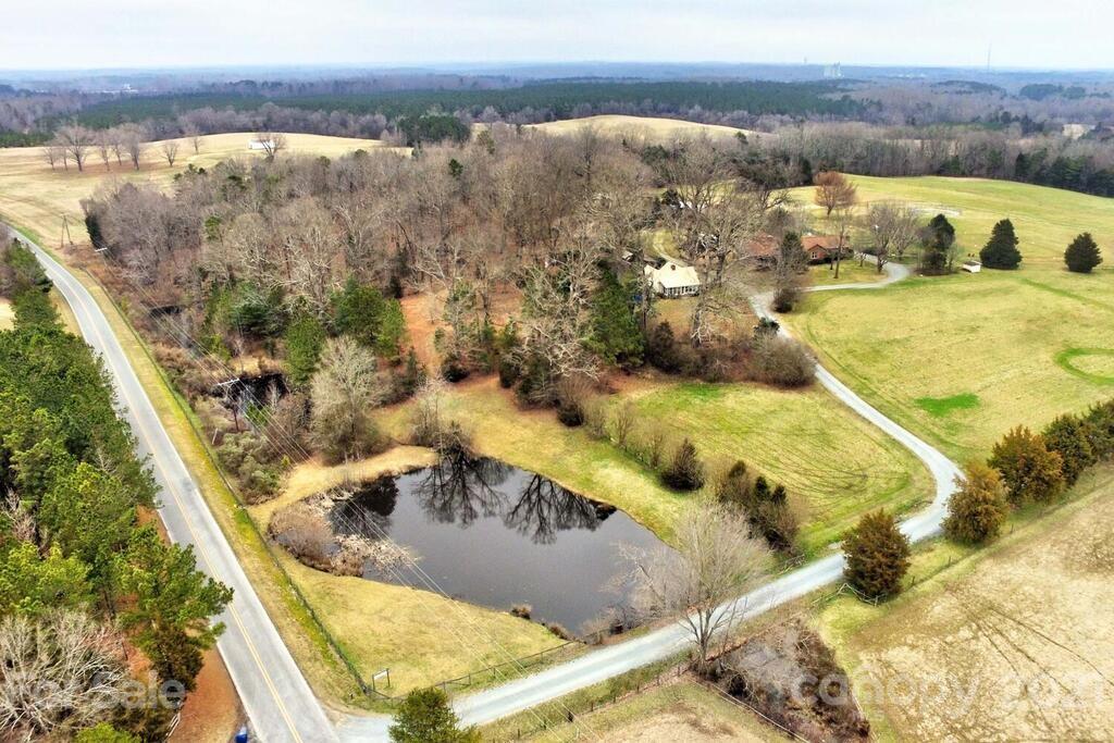 517 Old Pageland Monroe Road Monroe, NC 28112 - Photo 1 of 48 a view of a swimming pool with an outdoor seating