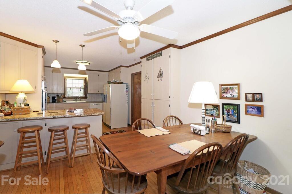 517 Old Pageland Monroe Road Monroe, NC 28112 - Photo 14 of 48 a view of a a dining room with furniture and wooden floor