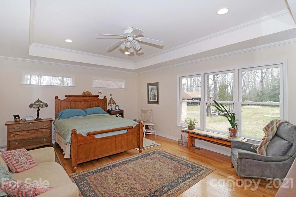 517 Old Pageland Monroe Road Monroe, NC 28112 - Photo 20 of 48 a bedroom with a bed and glass window