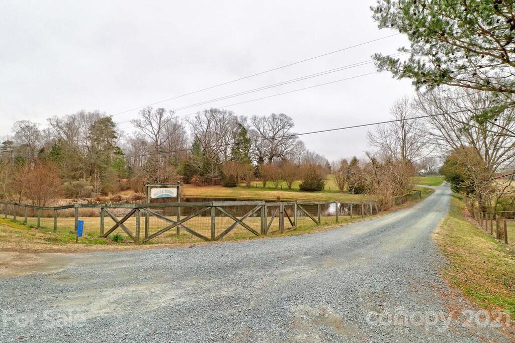 517 Old Pageland Monroe Road Monroe, NC 28112 - Photo 3 of 48 a view of a swimming pool with an outdoor seating