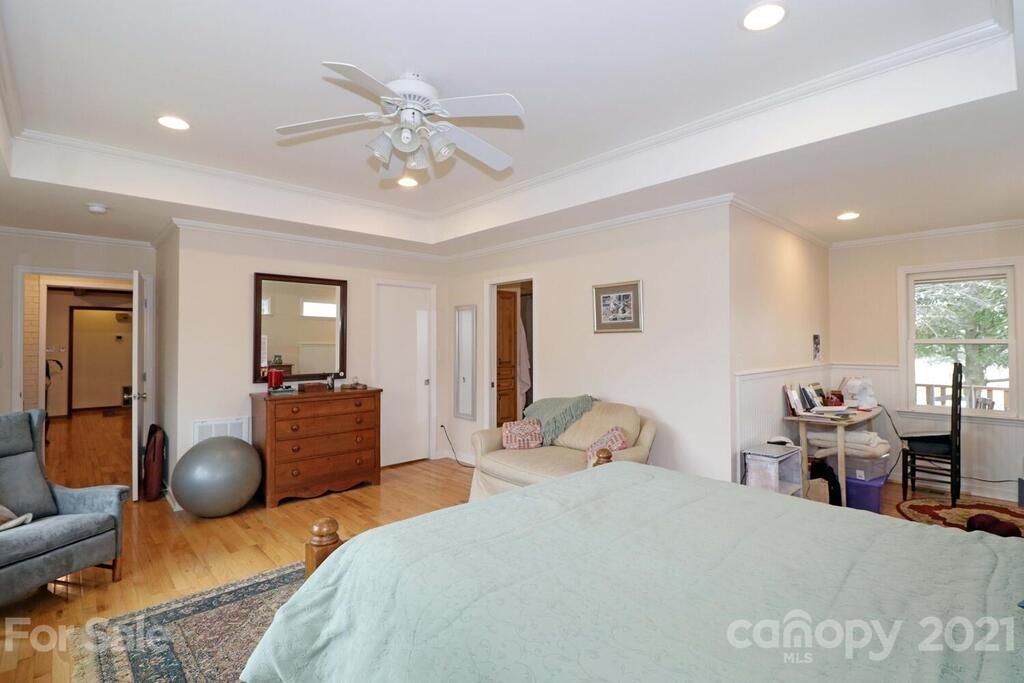517 Old Pageland Monroe Road Monroe, NC 28112 - Photo 21 of 48 a bedroom with a bed and wooden floor