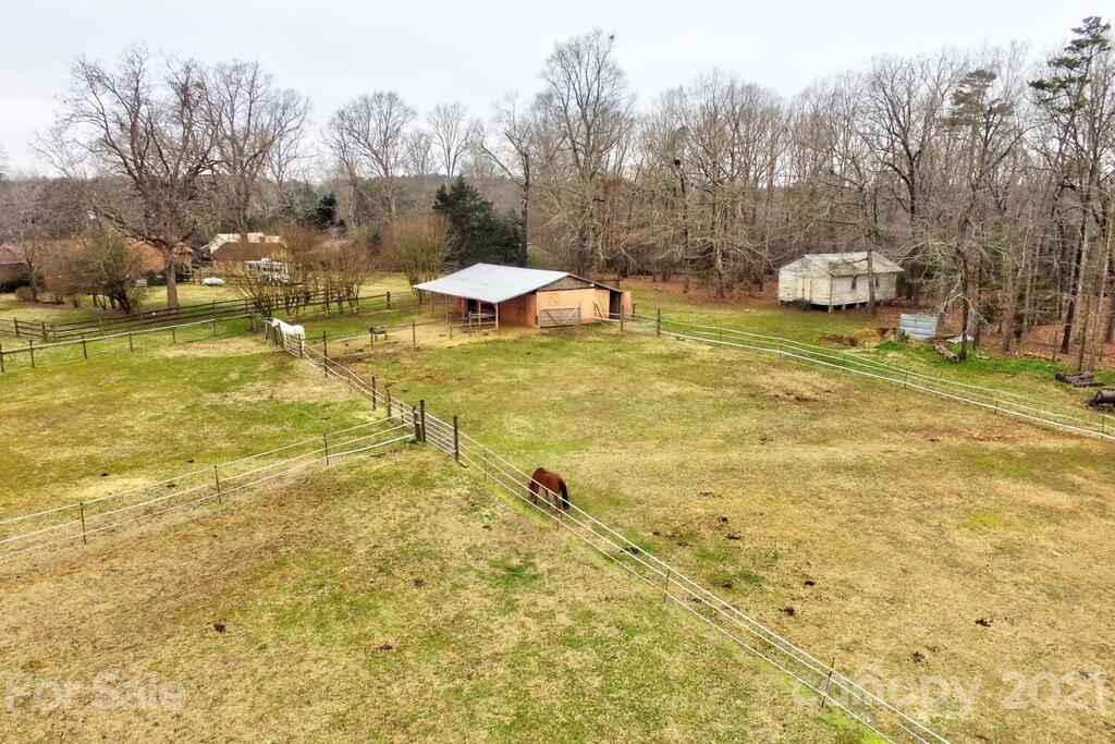 517 Old Pageland Monroe Road Monroe, NC 28112 - Photo 38 of 48 a view of a yard with swimming pool and trees