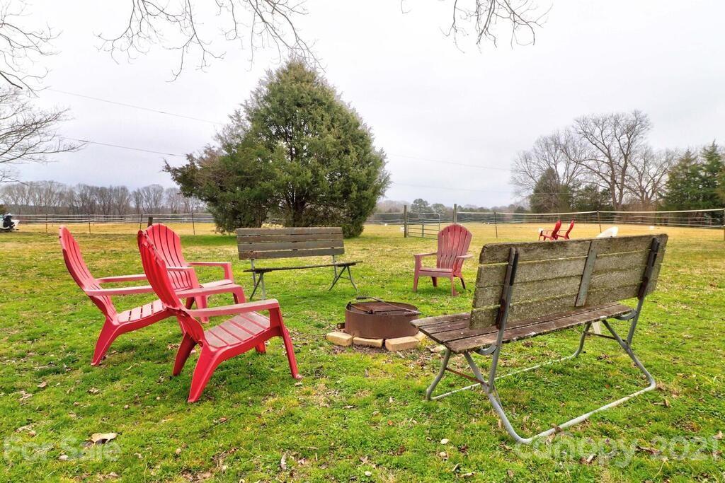 517 Old Pageland Monroe Road Monroe, NC 28112 - Photo 45 of 48 an outdoor sitting area with furniture and garden view