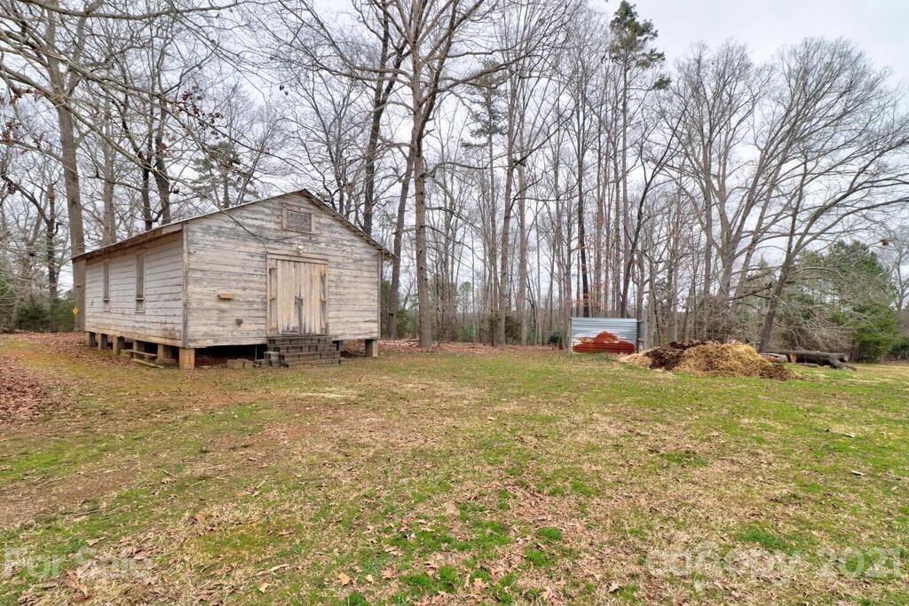 517 Old Pageland Monroe Road Monroe, NC 28112 - Photo 46 of 48 a view of a house with a yard and garage