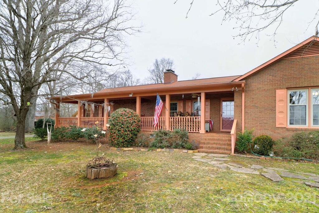 517 Old Pageland Monroe Road Monroe, NC 28112 - Photo 6 of 48 a front view of a house with garden