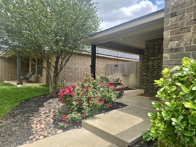 9505 Perry Avenue Amarillo, TX 79119 - Photo 3 of 26 Front porch with outdoor swing