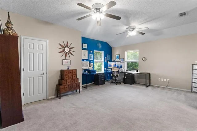 a view of a workspace with furniture and toys