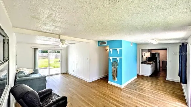 a living room with furniture and a window