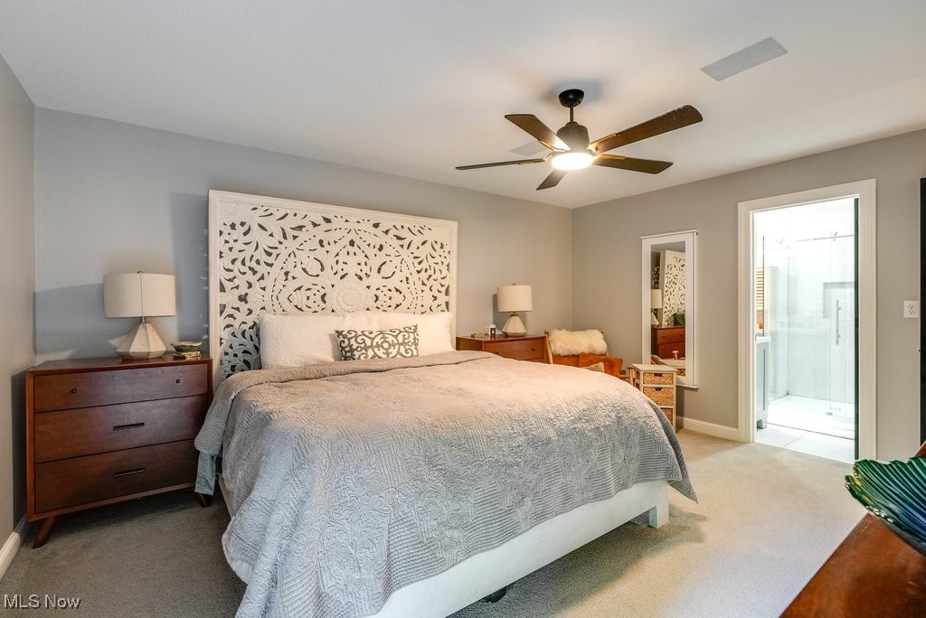 1598 Graham Road Silver Lake, OH 44224 - Photo 28 of 46 Carpeted bedroom featuring ceiling fan and connected bathroom