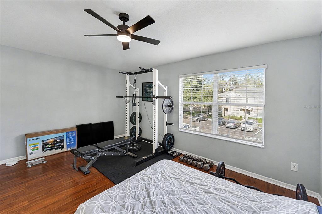 5860 Fishhawk Ridge Drive Lithia, FL 33547 - Photo 17 of 31 a bedroom with furniture and a window