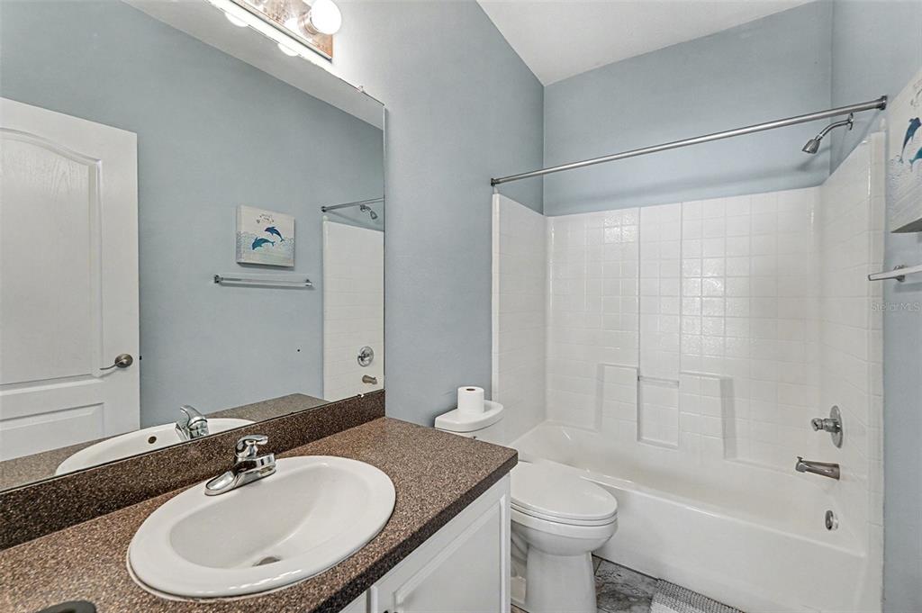 5860 Fishhawk Ridge Drive Lithia, FL 33547 - Photo 19 of 31 a bathroom with a sink a toilet and shower