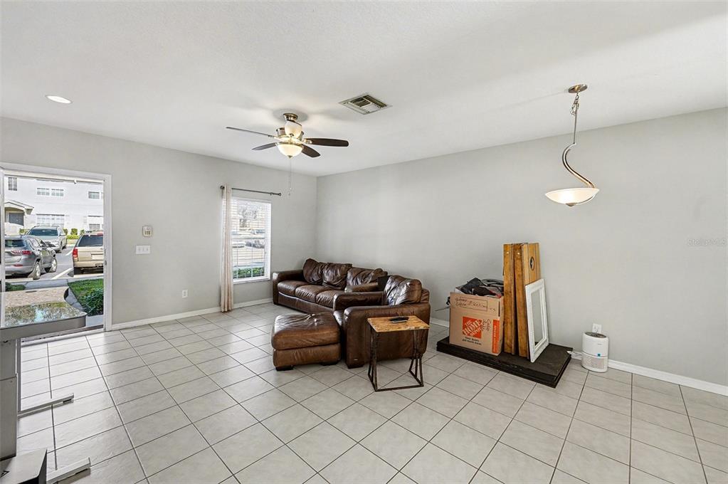 5860 Fishhawk Ridge Drive Lithia, FL 33547 - Photo 21 of 31 a living room with furniture and a ceiling fan