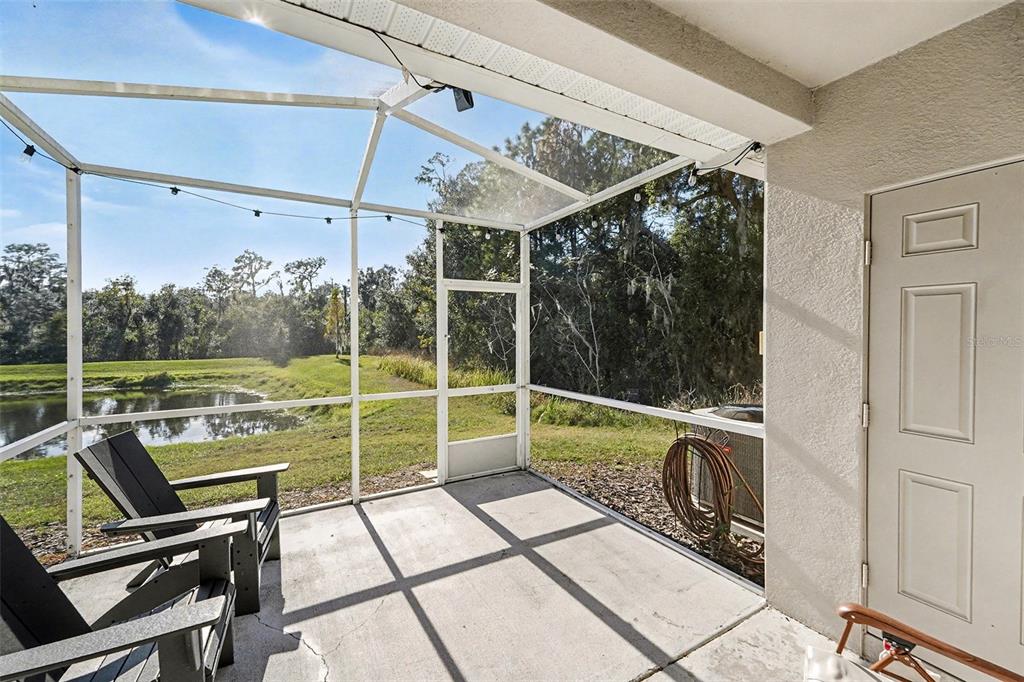 5860 Fishhawk Ridge Drive Lithia, FL 33547 - Photo 25 of 31 a view of a chair and tables in the balcony