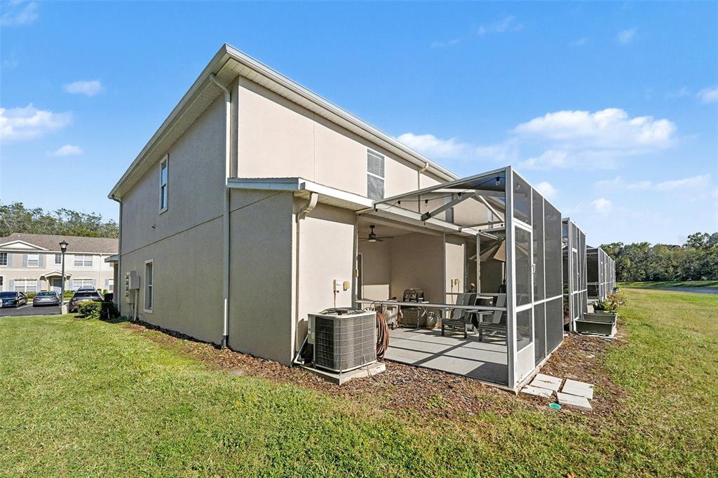 5860 Fishhawk Ridge Drive Lithia, FL 33547 - Photo 31 of 31 a view of a house with a wooden deck and furniture