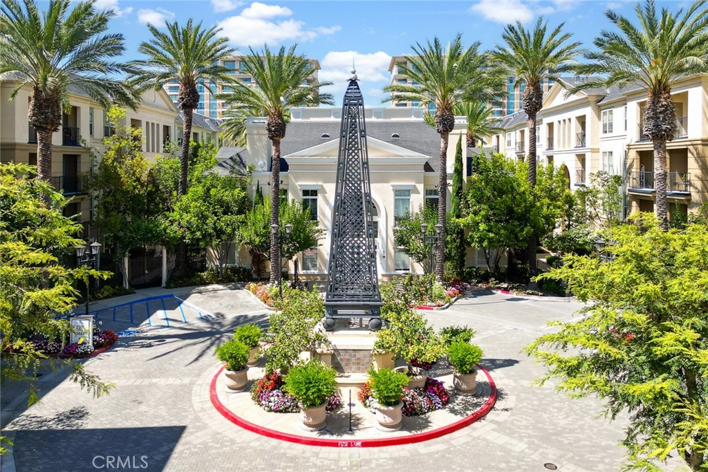 3311 Watermarke Place Irvine, CA 92612 - Photo 13 of 33 a front view of multi story residential apartment building with yard