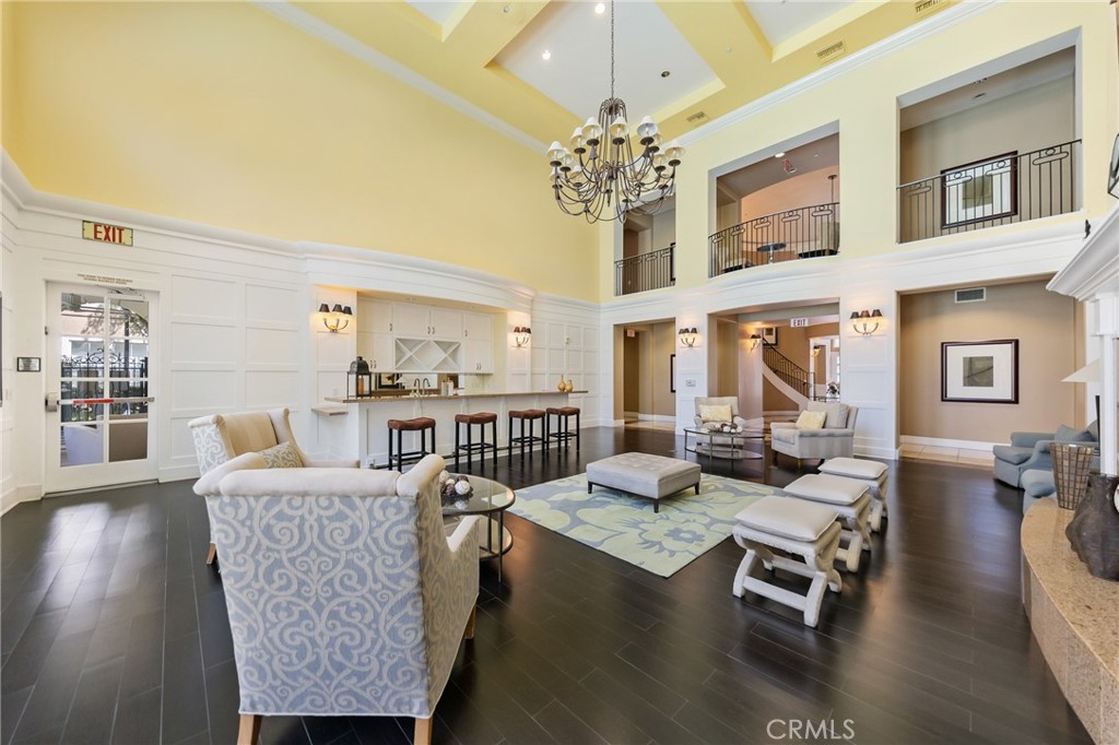 3311 Watermarke Place Irvine, CA 92612 - Photo 23 of 33 a living room with fireplace furniture and a chandelier