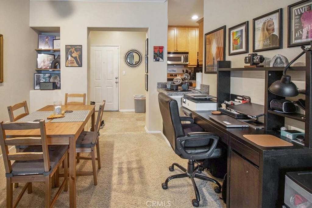 3311 Watermarke Place Irvine, CA 92612 - Photo 4 of 33 a kitchen with a table and chairs in it