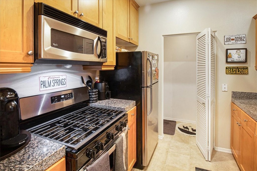 3311 Watermarke Place Irvine, CA 92612 - Photo 6 of 33 a kitchen with a stove and a microwave