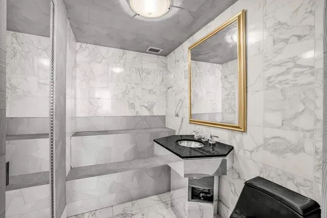 a bathroom with a sink and a mirror