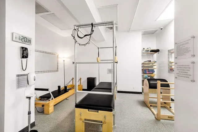 a bedroom with furniture and wooden floor