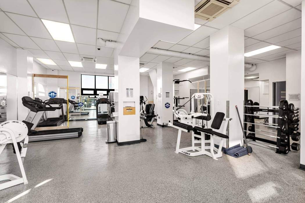 870 United Nations Plaza, Unit 28A Manhattan, NY 10017 - Photo 27 of 28 a view of a room with gym equipment