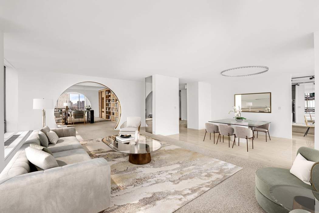 870 United Nations Plaza, Unit 28A Manhattan, NY 10017 - Photo 4 of 28 a living room with furniture a rug and a large window