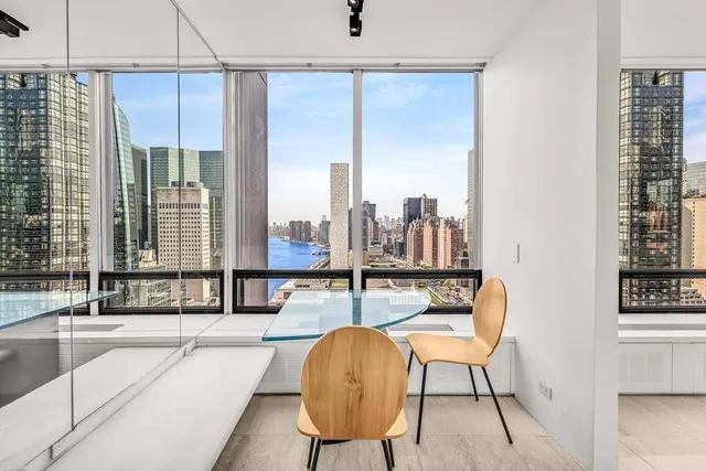 a kitchen with stainless steel appliances granite countertop a sink a stove and a wooden cabinets