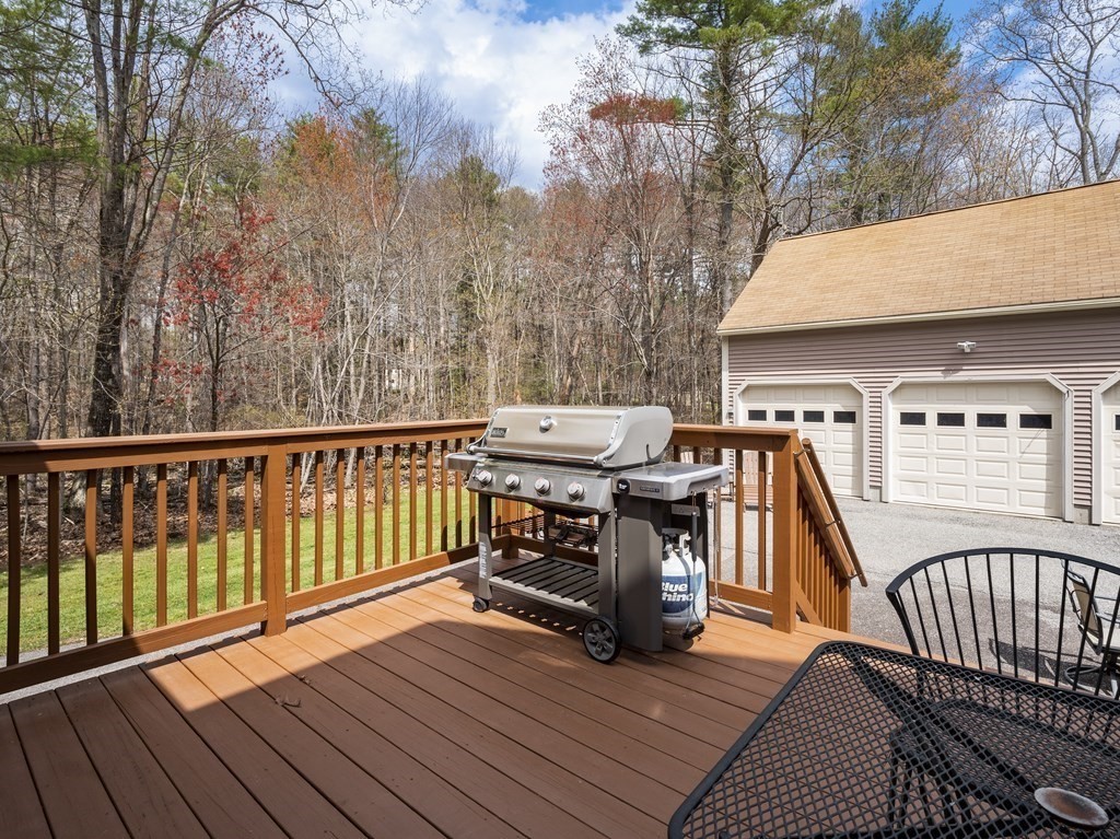 17 Chestnut Road Tyngsboro, MA 01879 - Photo 29 of 41 a view of a deck with wooden floor and fence