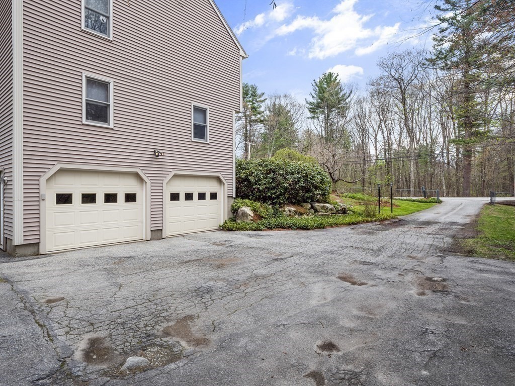 17 Chestnut Road Tyngsboro, MA 01879 - Photo 34 of 41 a view of a house with a backyard and bushes