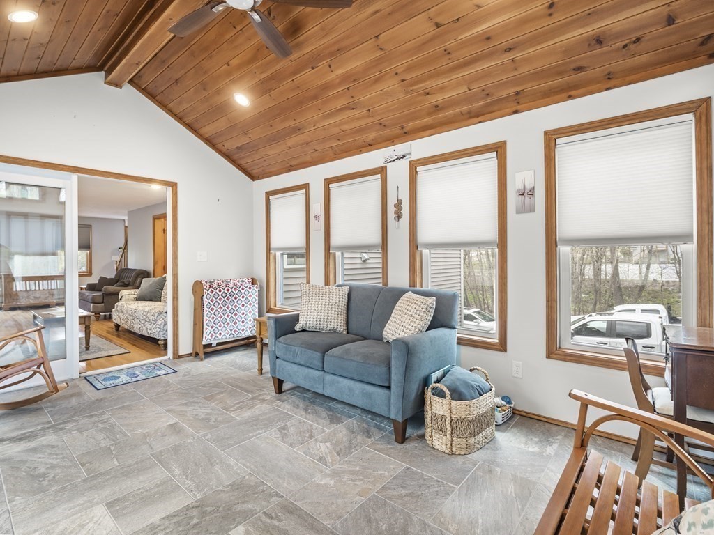 17 Chestnut Road Tyngsboro, MA 01879 - Photo 7 of 41 a living room with furniture and a large window