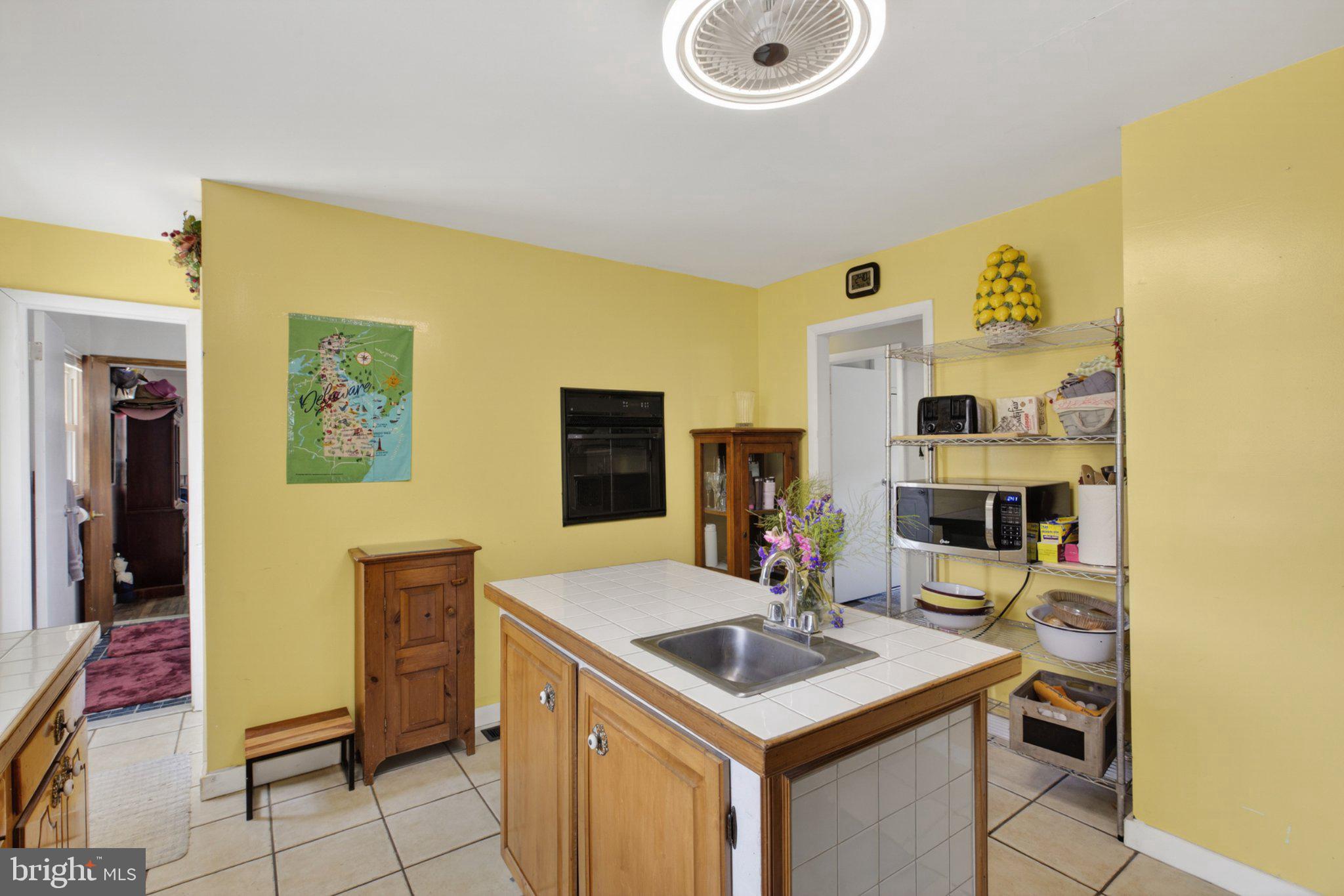 310 Dogtown Road Townsend, DE 19734 - Photo 14 of 43 Sunny kitchen with cheerful yellow walls.