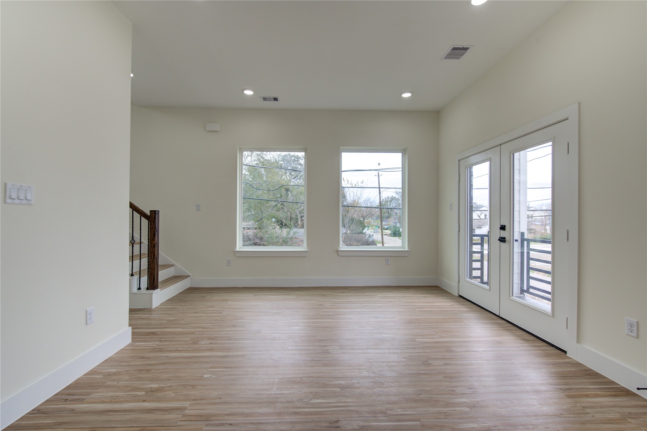4308 Alice Street Houston, TX 77021 - Photo 11 of 25 wooden floor in an empty room with a window