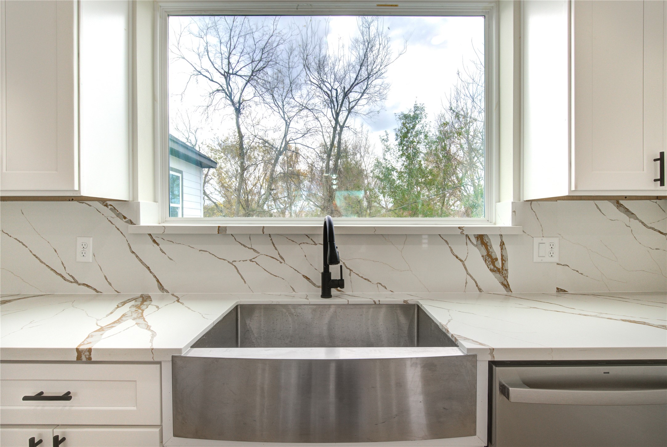 4308 Alice Street Houston, TX 77021 - Photo 19 of 25 a sink sitting in a kitchen next to a window