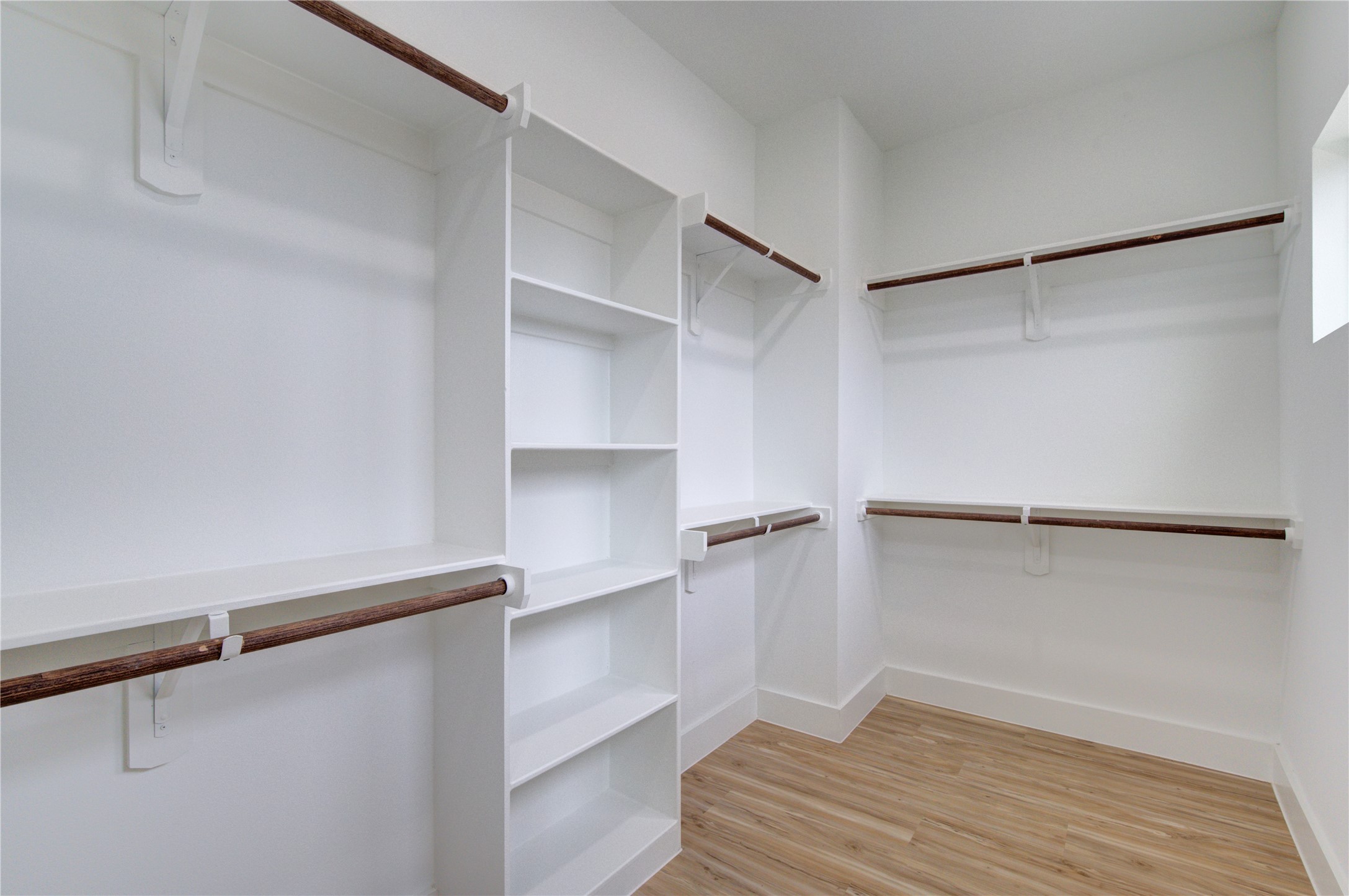 4308 Alice Street Houston, TX 77021 - Photo 23 of 25 a view of walk in closet with empty racks