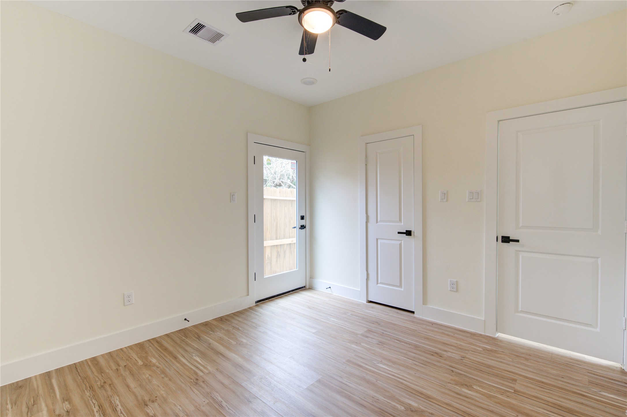 4308 Alice Street Houston, TX 77021 - Photo 7 of 25 wooden floor in an empty room with a window