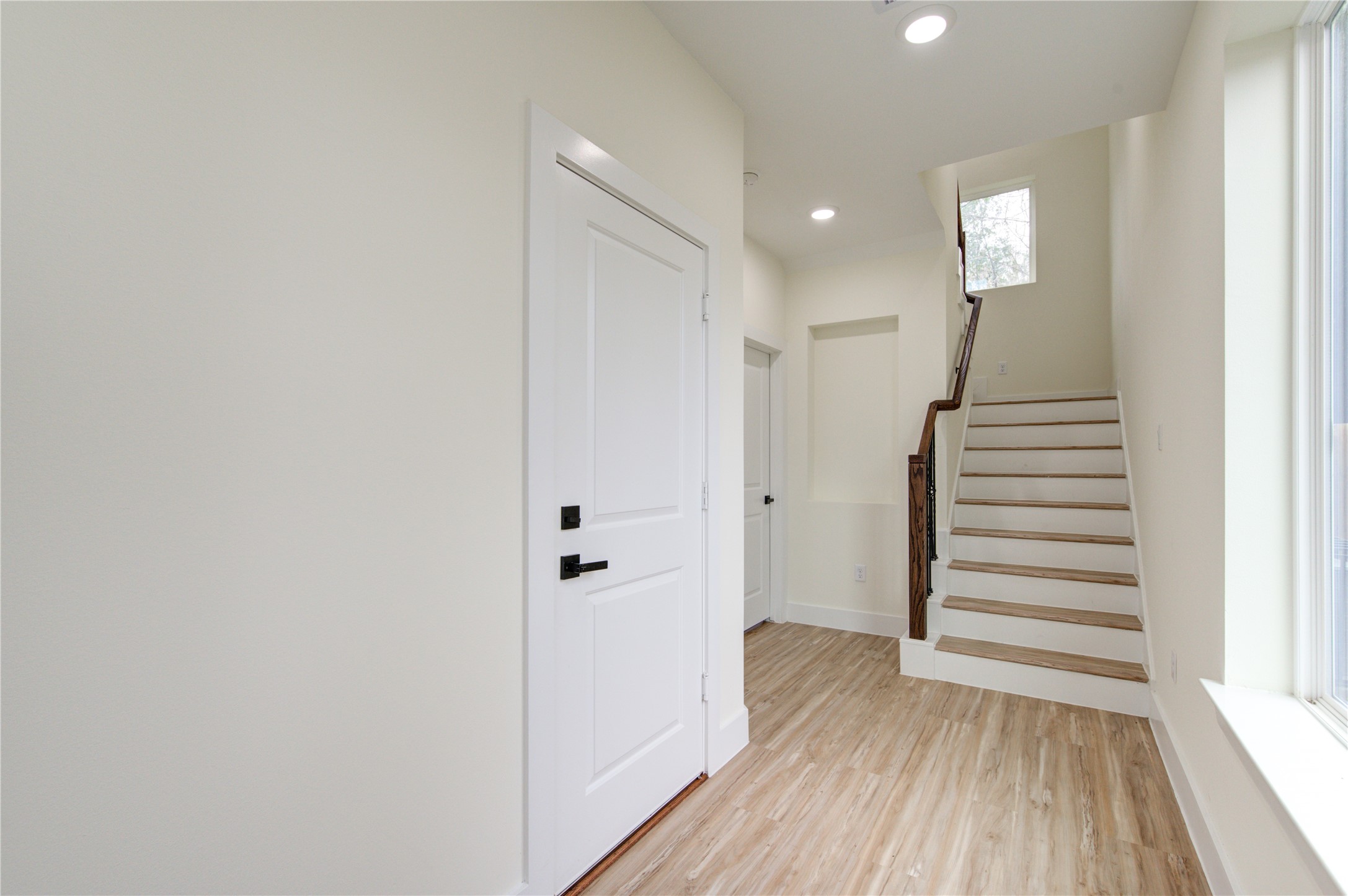 4308 Alice Street Houston, TX 77021 - Photo 9 of 25 a view of a hallway with wooden floor and entryway