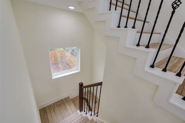 a view of an entryway with wooden floor