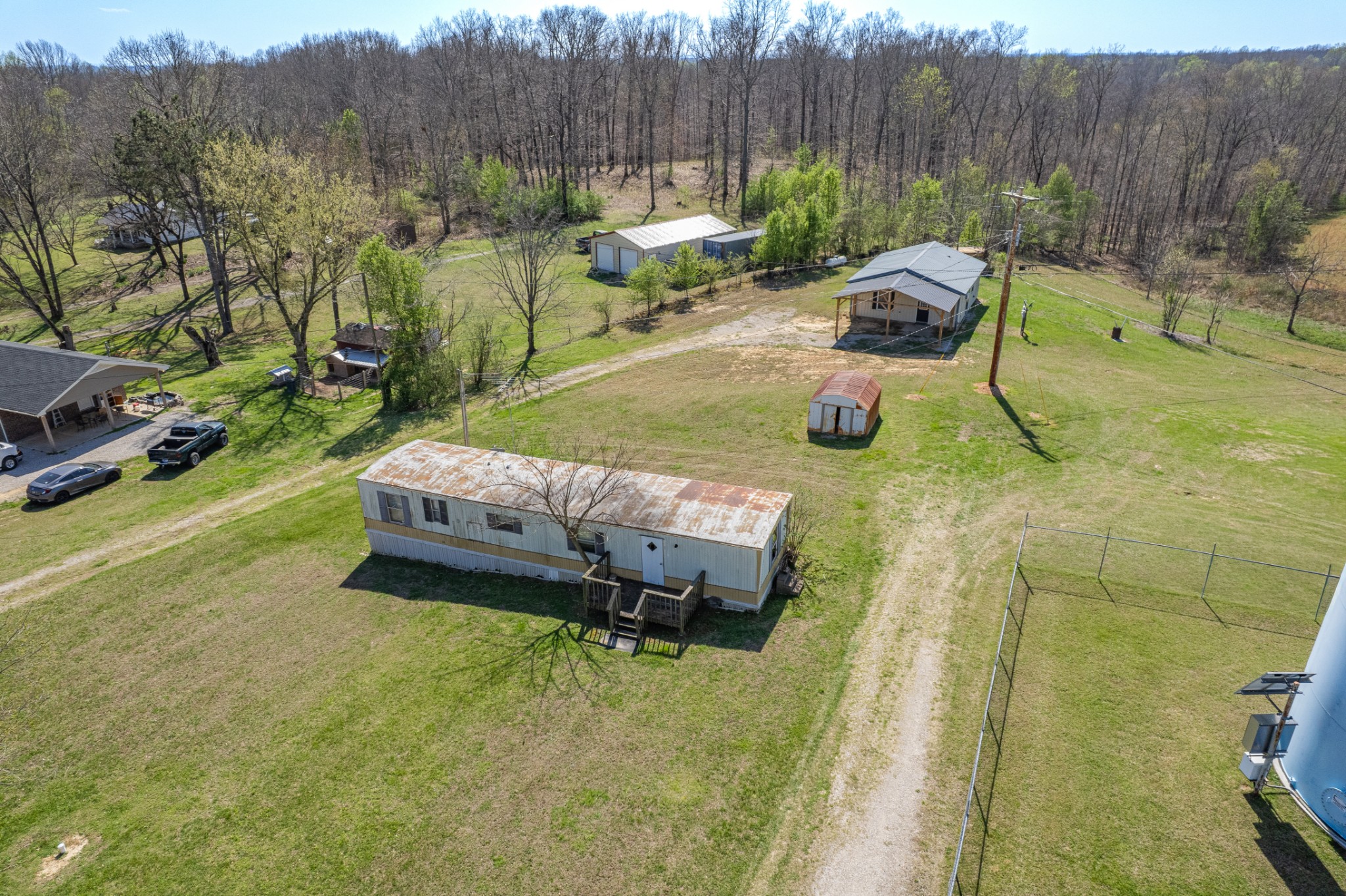 3247 Woolard Road Santa Fe, TN 38482 - Photo 19 of 20 a view of a backyard with table and chairs with wooden fence