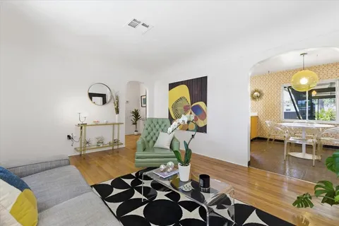 a living room with furniture and a table