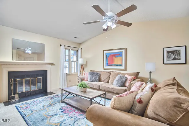 a living room with furniture a couch and a fireplace