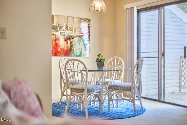 a view of a balcony with wooden floor and fence