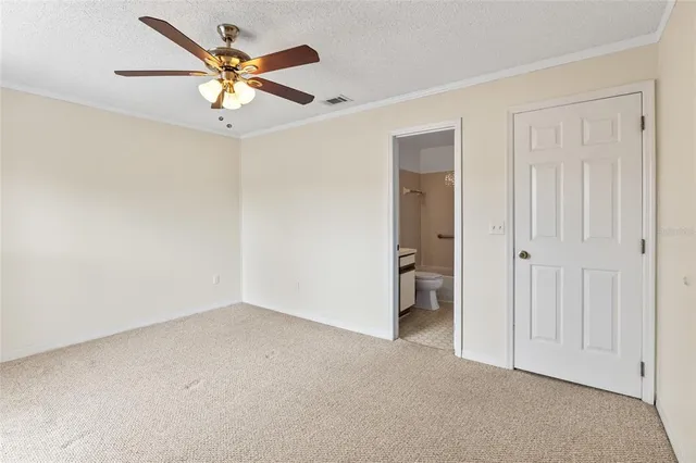 a bathroom with a toilet sink and shower