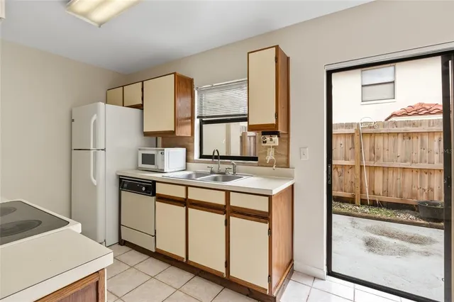 a kitchen with stainless steel appliances a stove and a refrigerator