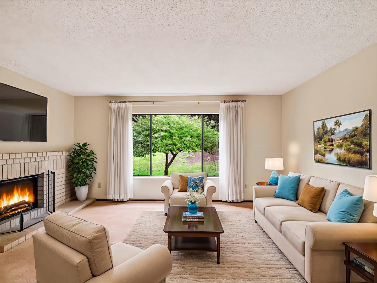 7391 Vía Cantares San Jose, CA 95135 - Photo 17 of 45 a living room with furniture and a fireplace