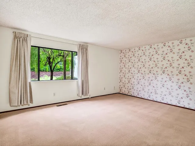 an empty room with large window