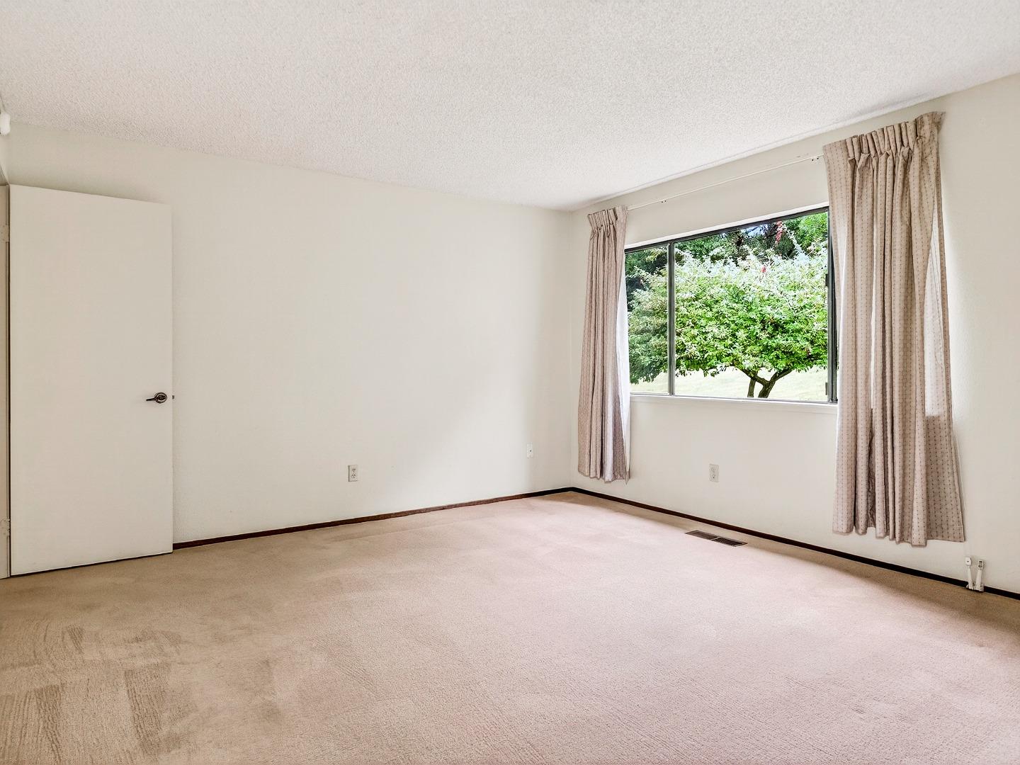 7391 Vía Cantares San Jose, CA 95135 - Photo 23 of 45 a view of an empty room with a window