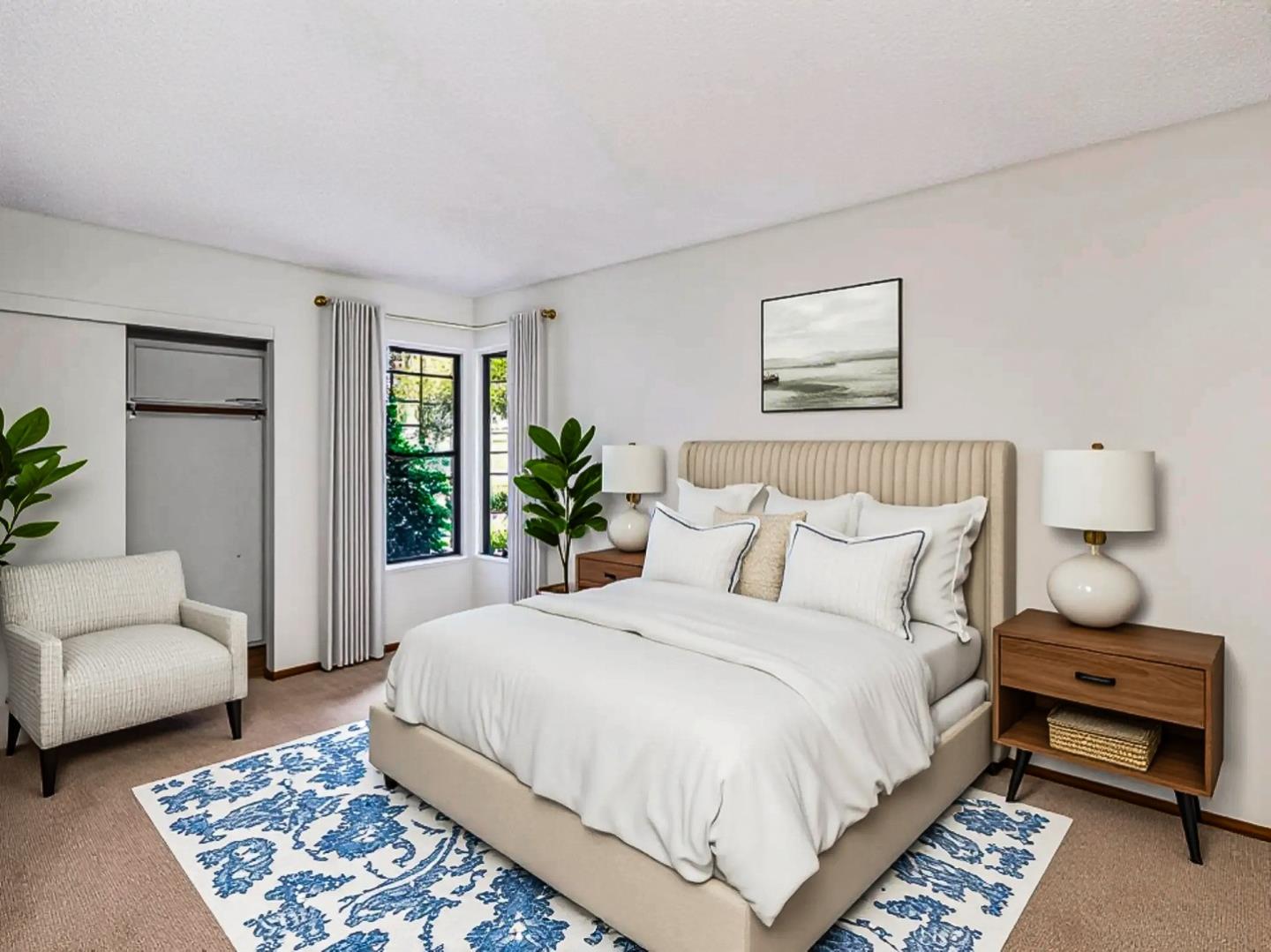 7391 Vía Cantares San Jose, CA 95135 - Photo 32 of 45 a bedroom with a bed a couch and a window