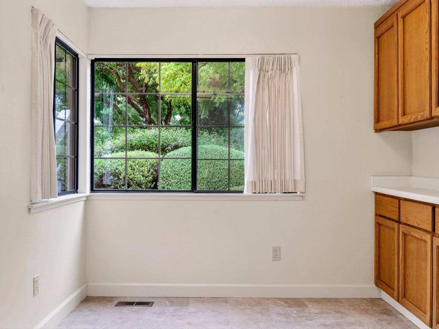 7391 Vía Cantares San Jose, CA 95135 - Photo 9 of 45 a view of a room that has a window and kitchen view
